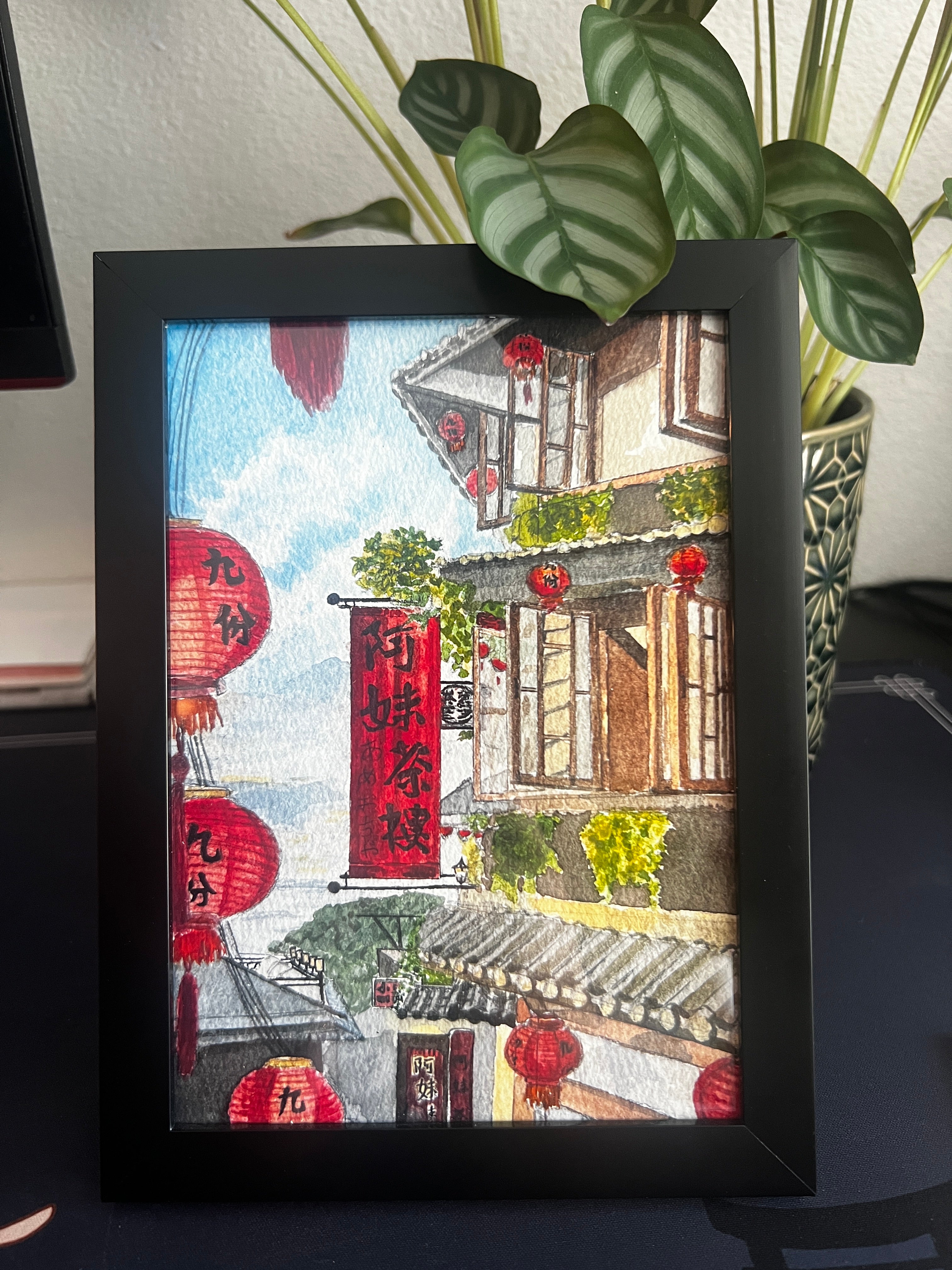 Jiufen Teahouse with red lanterns watercolor print in a black frame